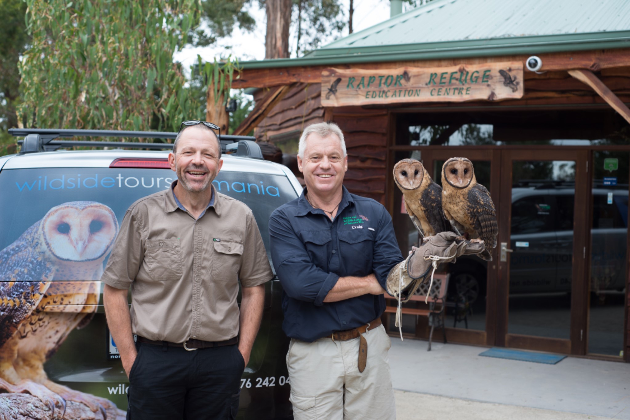 Erin and Craig with the owl mobile
